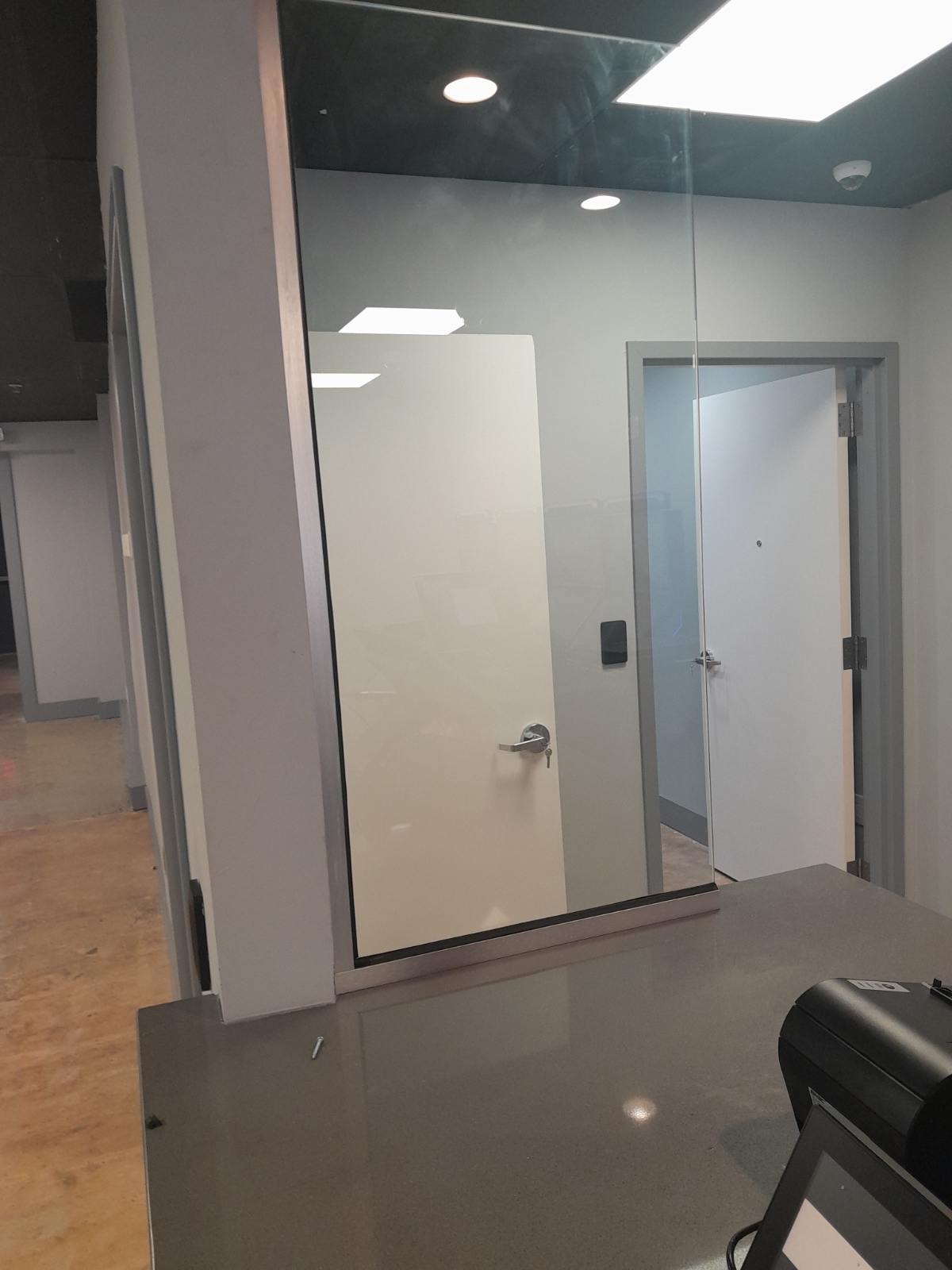 Completed office glass partition on a commercial interior build