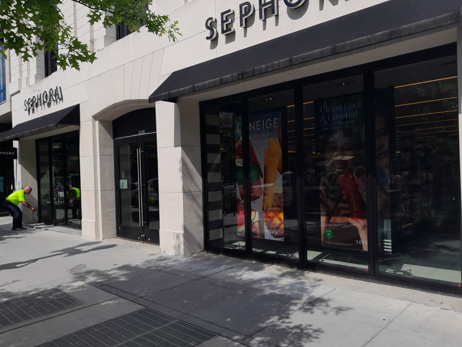 Completed commercial storefront glazing — a full run of glass set into a stone facade
